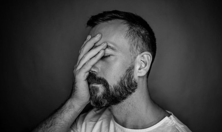 man suffering from emotional distress