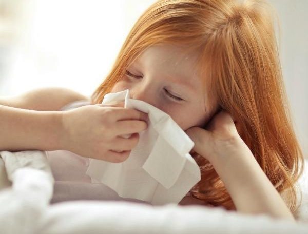 a little girl feeling sick